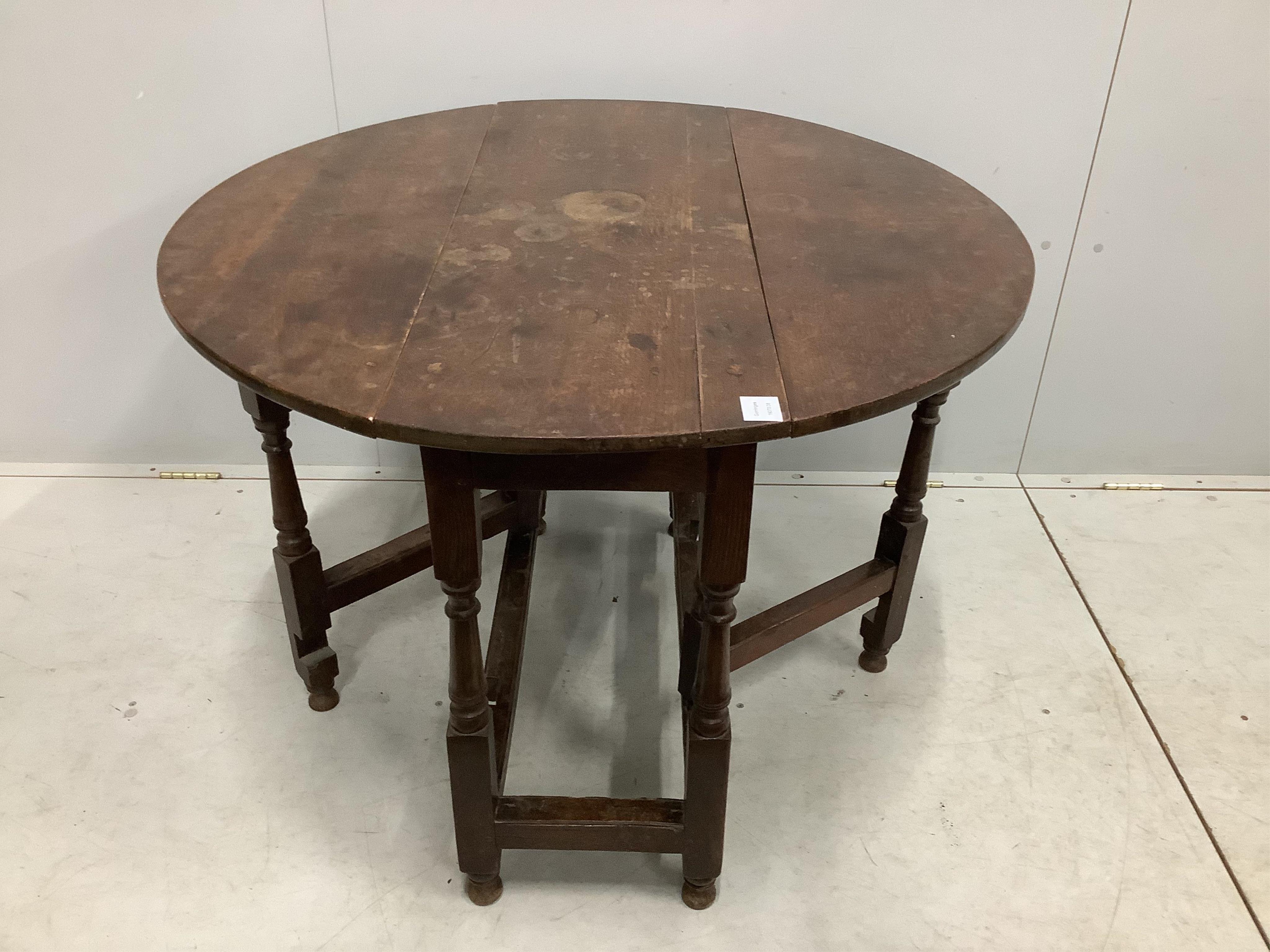 A small 18th century oak gate leg table, width 99cm, depth 38cm, height 72cm. Condition - fair